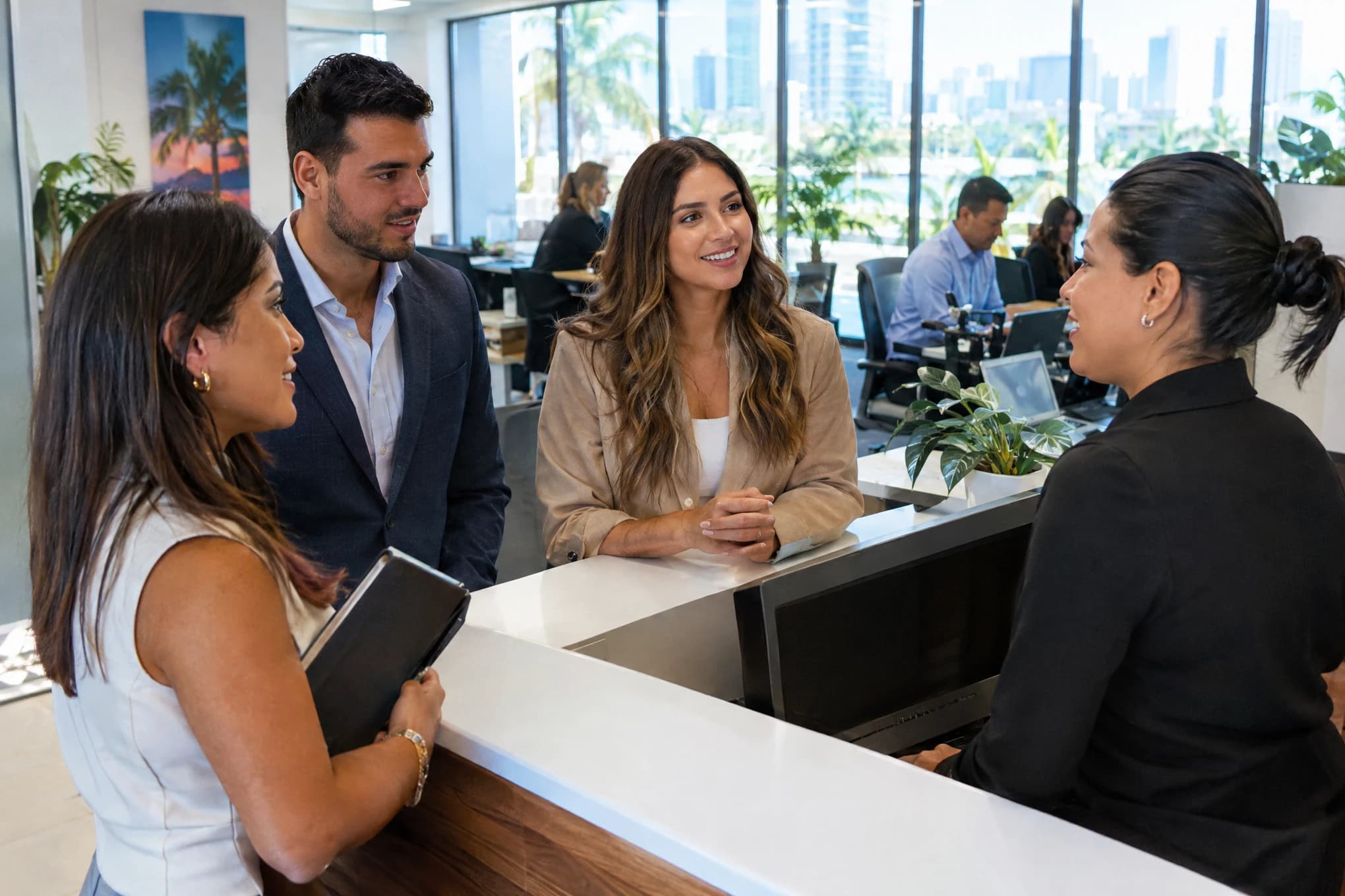 A Brito Marketing consultant talks with the receptionist and two salespeople at a client's office in Miami