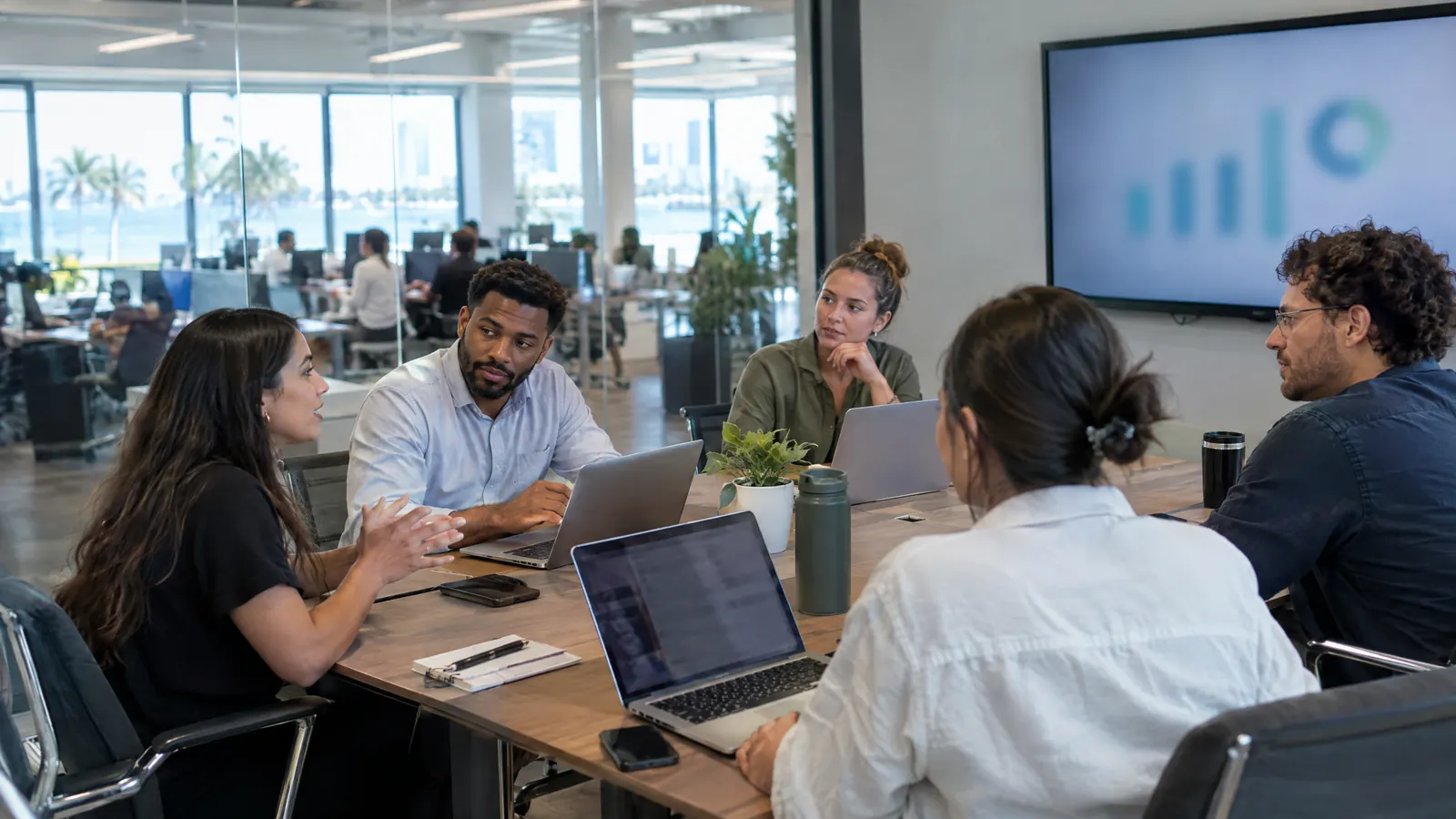 A company's marketing team reviewing results in a meeting room