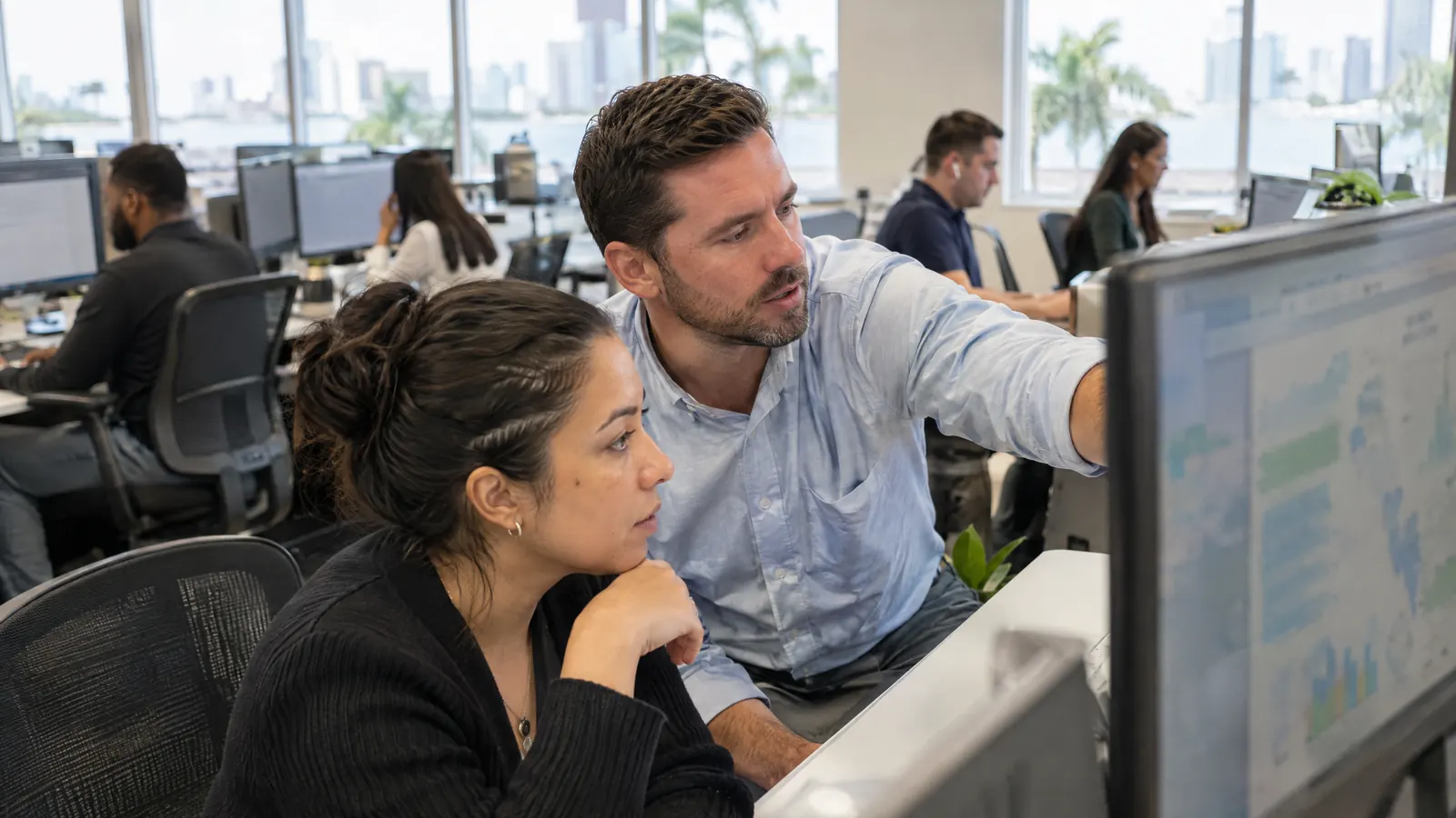 A logistics company's operations team reviewing a data dashboard