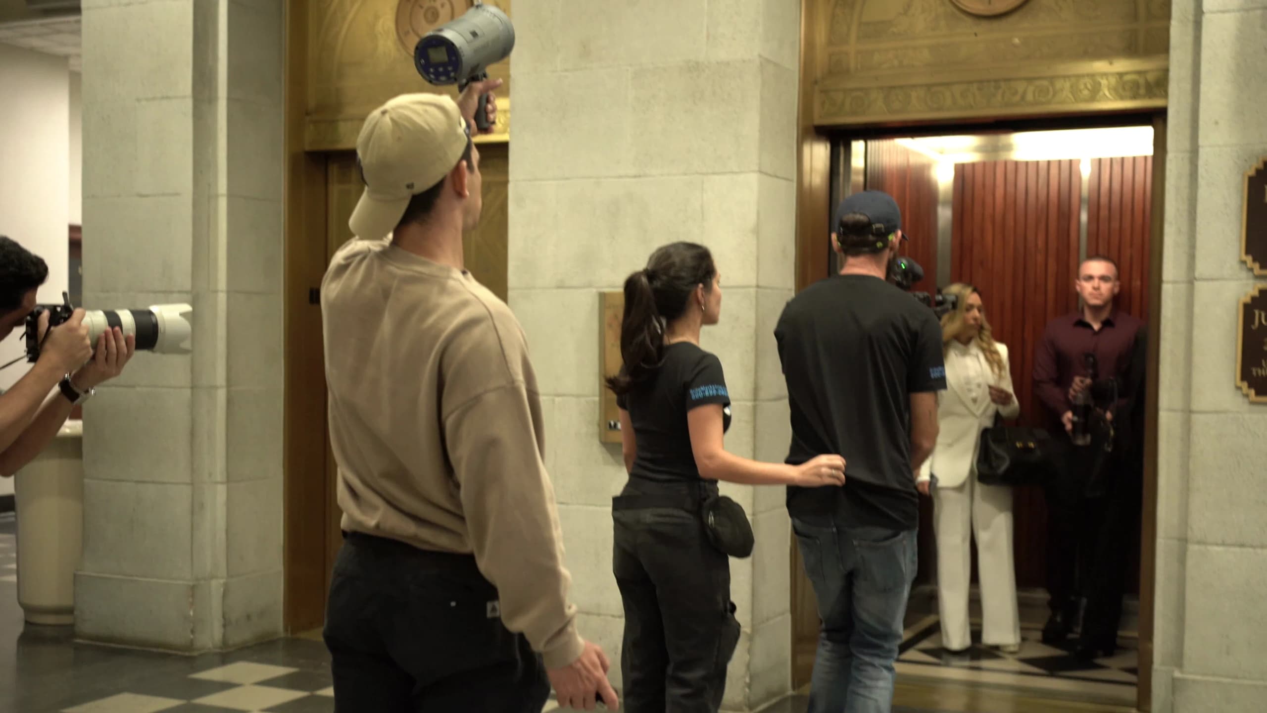 The Brito Marketing photographer and crew work in the courthouse lobby during the VPP Law Firm shoot.